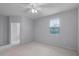 Spacious bedroom with neutral colors, ceiling fan, closet and plenty of natural light at 604 Fortanini Cir, Ocoee, FL 34761