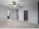 Large bedroom featuring two closets and an ensuite bathroom at 604 Fortanini Cir, Ocoee, FL 34761