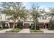 Charming townhomes boast well-maintained landscaping, driveways, and beautiful curb appeal at 604 Fortanini Cir, Ocoee, FL 34761