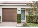 Charming front entrance with a single car garage and well-maintained landscaping at 604 Fortanini Cir, Ocoee, FL 34761