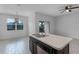 Open concept kitchen with island, pendant lighting, and a view of the backyard at 604 Fortanini Cir, Ocoee, FL 34761