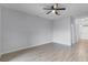 Spacious room with neutral paint, modern flooring, and abundant natural light at 604 Fortanini Cir, Ocoee, FL 34761