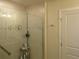 Bathroom featuring walk-in shower with tile surround and glass door at 6147 Arbor Watch Loop, Orlando, FL 32829