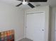 Bedroom featuring ceiling fan, closet with white doors, and neutral paint at 6147 Arbor Watch Loop, Orlando, FL 32829