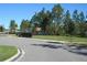 Community playground with play structures, surrounded by trees and green space at 6147 Arbor Watch Loop, Orlando, FL 32829