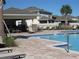 Inviting community pool area with comfortable seating and a covered pavilion at 6147 Arbor Watch Loop, Orlando, FL 32829