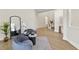 Inviting living room area with modern decor, wood-look floors, and stylish accent furniture at 6881 Piazza St, Orlando, FL 32819