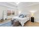 Bright main bedroom with hardwood floors, soft blue decor, and a large window, offering calm at 6881 Piazza St, Orlando, FL 32819