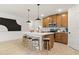 Modern kitchen with center island seating, stainless steel appliances, and wood cabinetry at 8718 Sw 139Th Place Rd # 29, Ocala, FL 34473