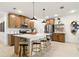 Modern kitchen featuring a large island, stainless steel appliances, and stylish pendant lighting at 8718 Sw 139Th Place Rd # 29, Ocala, FL 34473