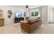 Cozy living room with a comfortable leather sofa, media center, and bright natural light at 8718 Sw 139Th Place Rd # 29, Ocala, FL 34473