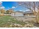 The backyard features a screened-in porch, white exterior, and a fenced perimeter at 9526 Water Fern Cir, Clermont, FL 34711