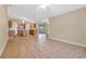 Open concept eat-in kitchen and dining area with sliding glass doors at 9526 Water Fern Cir, Clermont, FL 34711