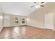 Open living room with neutral paint, high ceilings and tile floors at 9526 Water Fern Cir, Clermont, FL 34711