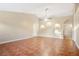 Bright living area with tile flooring, neutral walls, and archway feature at 9526 Water Fern Cir, Clermont, FL 34711