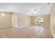 Bright living area with arched window, neutral walls, and tile flooring at 9526 Water Fern Cir, Clermont, FL 34711