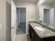 Bathroom with granite countertops and a large mirror at 987 Desert Candle Dr, Ocoee, FL 34761