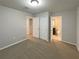 Bedroom with closet and bathroom access, painted in neutral color at 987 Desert Candle Dr, Ocoee, FL 34761