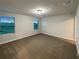 Bedroom features neutral carpet, natural light, and spacious layout at 987 Desert Candle Dr, Ocoee, FL 34761