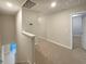 Upstairs hallway features carpet, neutral paint, recessed lighting, and doors to rooms at 987 Desert Candle Dr, Ocoee, FL 34761