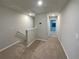 Carpeted hallway upstairs with neutral paint and recessed lighting at 987 Desert Candle Dr, Ocoee, FL 34761