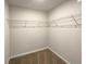 Walk-in closet with carpeted floors and wire shelving for ample storage at 987 Desert Candle Dr, Ocoee, FL 34761