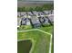 Aerial view of a community featuring well-maintained homes and beautiful landscaping near a pond at 10732 Petrillo Way, Winter Garden, FL 34787