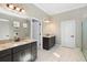Spacious bathroom with double vanity, walk-in shower, and marble floors at 10732 Petrillo Way, Winter Garden, FL 34787