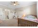 Inviting bedroom with a cute decor, adjacent to a pristine bathroom, adding convenience and style at 10732 Petrillo Way, Winter Garden, FL 34787