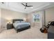 Bedroom with tray ceiling, window, and carpet at 10732 Petrillo Way, Winter Garden, FL 34787