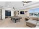 Bright bonus room features a lounge area, billiard table, and large window with views of the neighborhood at 10732 Petrillo Way, Winter Garden, FL 34787