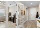 Bright foyer featuring tile floors, and a decorative glass door leading to an office or den at 10732 Petrillo Way, Winter Garden, FL 34787