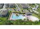 Aerial view of a community pool with ample seating and well-maintained landscaping and amenities at 10732 Petrillo Way, Winter Garden, FL 34787