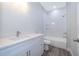 Stylish bathroom featuring a sleek vanity with quartz countertop and modern fixtures at 1104 Grove Manor Dr, Sanford, FL 32771