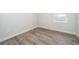 Small bedroom with hardwood floors, one window and neutral paint perfect for a room or office at 1104 Grove Manor Dr, Sanford, FL 32771