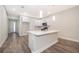 Modern kitchen featuring an island with seating, stainless appliances, and ample storage space at 1104 Grove Manor Dr, Sanford, FL 32771