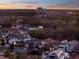 This aerial shot captures the community and landscape from above at sunset, offering a sense of location at 1281 Grand Traverse Pkwy, Reunion, FL 34747