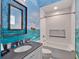 Themed bathroom with modern vanity, soaking tub, and wall painting at 1281 Grand Traverse Pkwy, Reunion, FL 34747