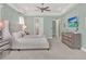 Spacious bedroom featuring a media center and doorways to the bathroom and closet at 1281 Grand Traverse Pkwy, Reunion, FL 34747
