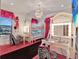 Themed bedroom with a bunk bed and vanity area with a zebra print chair at 1281 Grand Traverse Pkwy, Reunion, FL 34747