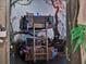 Themed bedroom features a bunk bed with murals of jungle foliage and a wooden ladder at 1281 Grand Traverse Pkwy, Reunion, FL 34747