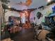 Whimsical bedroom featuring vibrant murals, a custom bunk bed and a themed play area at 1281 Grand Traverse Pkwy, Reunion, FL 34747