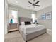 Bright bedroom with a neutral color palette, ceiling fan, and stylish décor at 1281 Grand Traverse Pkwy, Reunion, FL 34747