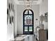 Bright foyer features a decorative front door, statement art, and light-colored furnishings at 1281 Grand Traverse Pkwy, Reunion, FL 34747