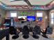 A graffiti themed game room has multiple arcade games, a gaming area, and comfortable seating at 1281 Grand Traverse Pkwy, Reunion, FL 34747