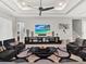 Well-decorated living room offering comfortable seating and an entertainment center at 1281 Grand Traverse Pkwy, Reunion, FL 34747
