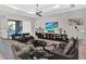 Comfortable living room with stylish decor, including a ceiling fan and entertainment center at 1281 Grand Traverse Pkwy, Reunion, FL 34747