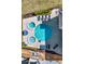 Aerial view of sparkling pool and two hot tubs surrounded by a paved deck with lounge chairs at 1281 Grand Traverse Pkwy, Reunion, FL 34747