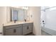 Modern bathroom featuring a double vanity with stone countertop, undermount sinks, and a tiled shower and tub combo at 13676 Mcmillan Dr, Orlando, FL 32827