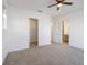Spacious bedroom with a ceiling fan, closet, and ensuite bathroom access at 13676 Mcmillan Dr, Orlando, FL 32827
